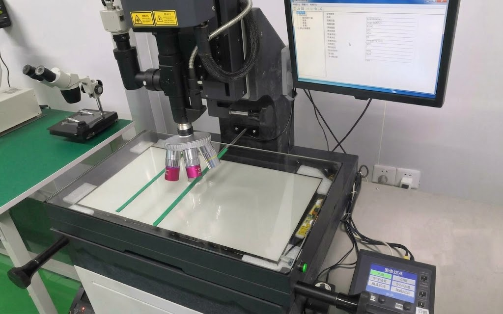 Microscope platform for locating and repairing patterned chromium defects