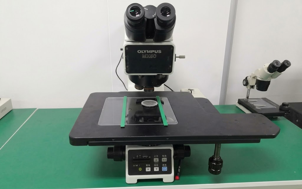 Olympus MX50 microscope inspection platform used for patterned glass and photomask review